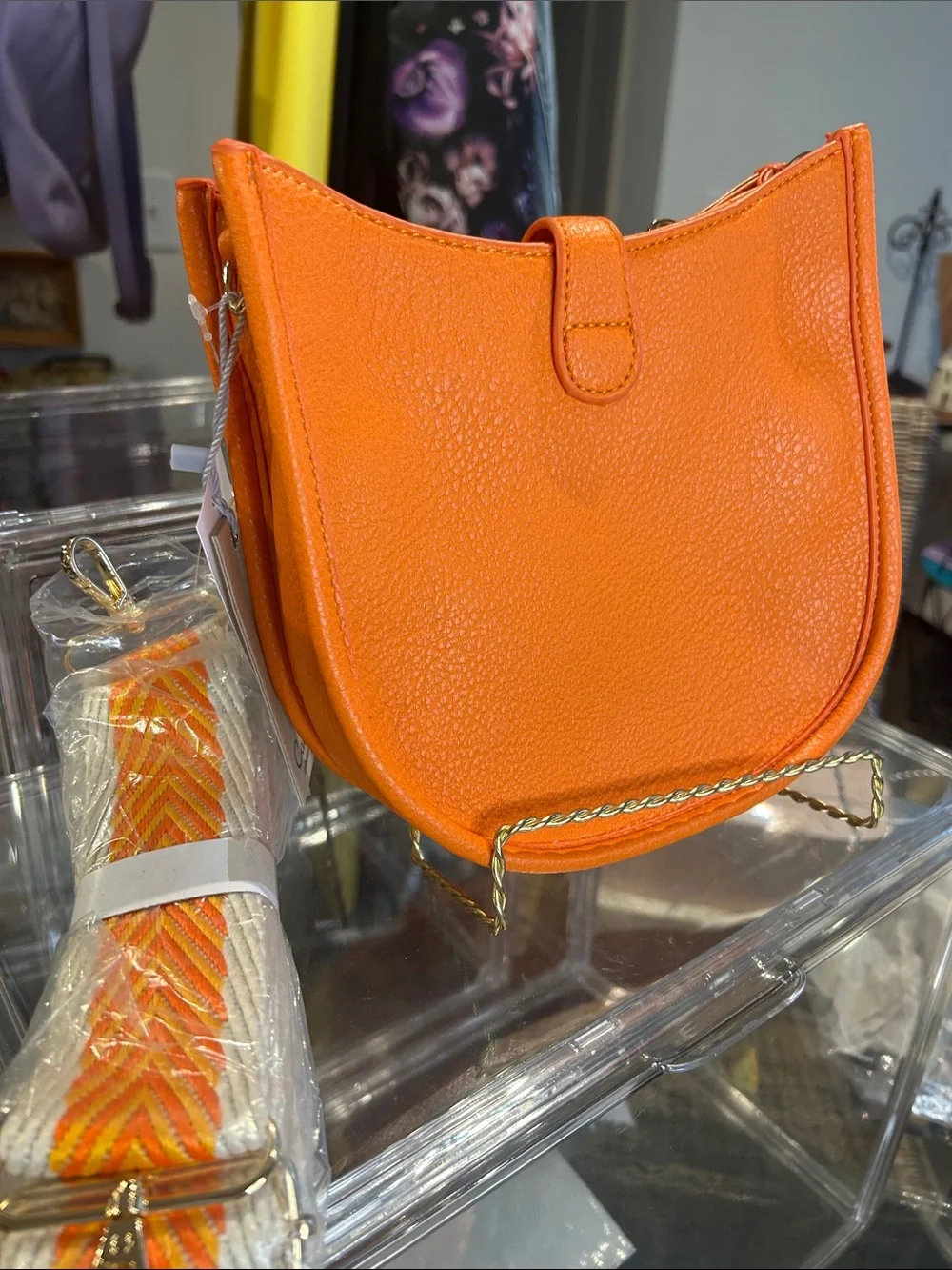 Calin Orange Pebbled Vegan Leather Crossbody with Guitar Strap 8”x 2.25”x 7” NWT